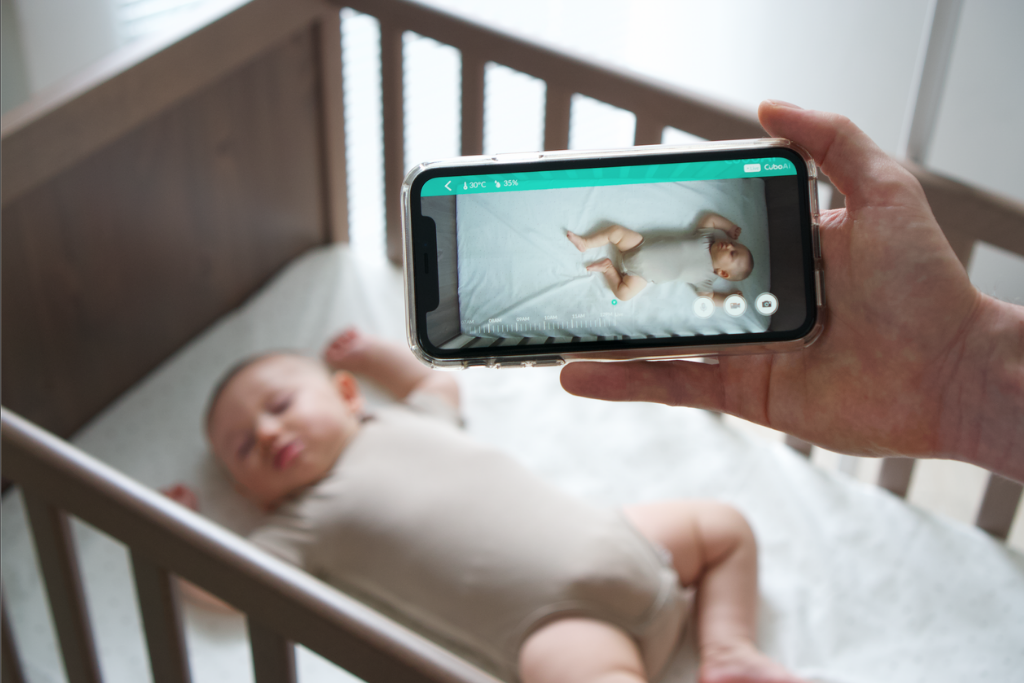Top Baby Monitor Apps It’s 2020 and you still don’t have your baby camera on your phone? No worries, in this post we’ll talk about the top baby monitor apps, baby monitors that have an app, if you can use your phone as a baby monitor and more. As our homes get more and more connected to our phones and smart watches, the way we keep it and our families safe changes. Home security cameras have actually replaced doorbells the way cell phones replaced landlines. As a result, it’s no surprise that baby monitors have moved so much farther than simply listening to your baby. Smart babies are, more than another option for keeping babies safe, the updated version of traditional technologies for monitoring our little ones. The best smart baby monitors have their respective apps where you can see the live video feed of your baby in their nursery, set up notifications and more! There are also options without cameras that are just apps that some parents opt for. Let’s take a look at some of the best baby monitoring apps for Android and iPhone. Guide to this post: -What baby monitors have an app? - Can I use my phone as a baby monitor? - How to turn your phone into a baby monitor? -Cloud storage safe wifi baby monitor apps What baby monitors have an app? Lots of babygear these days have apps. From the Snoo to the Hatch and more, tech is finding its way into nurseries as well as the rest of your home. Apps like the above control devices that rock your baby or play white noise for them during the night. While some look at this as a removed way of caring for baby, its intention is to allow parents to recharge while their baby gets the extra comfort they need without being overly aroused by their parents coming into the room. Any parent who doesn’t want to wake their child appreciates a way to remotely rock them or play sounds they enjoy. This, more than a disconnect between parent and child, allows them both to rest easier. Some popular baby monitors with apps include Cubo Ai, Owlet, Nanit, among many others. These top baby monitors tap into the need modern parents have to see baby anytime, from anywhere, understand their sleep better, and get alerts for important events (crying, motion, face covered events, etc.) Of course, lots of these monitors with apps do a whole lot more than that, but it depends which you choose. Here’s the interface of Cubo Ai, for example.