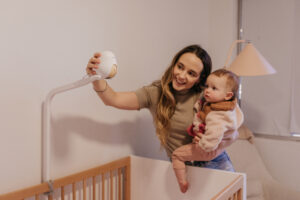 Mom with baby and CuboAi Smart Baby Monitor